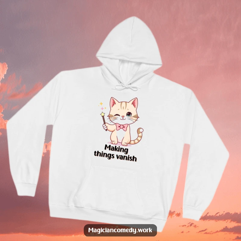 Funny hoodie featuring a whiskered cat in a bowtie, performing a magic trick by making a wand disappear with its paw.